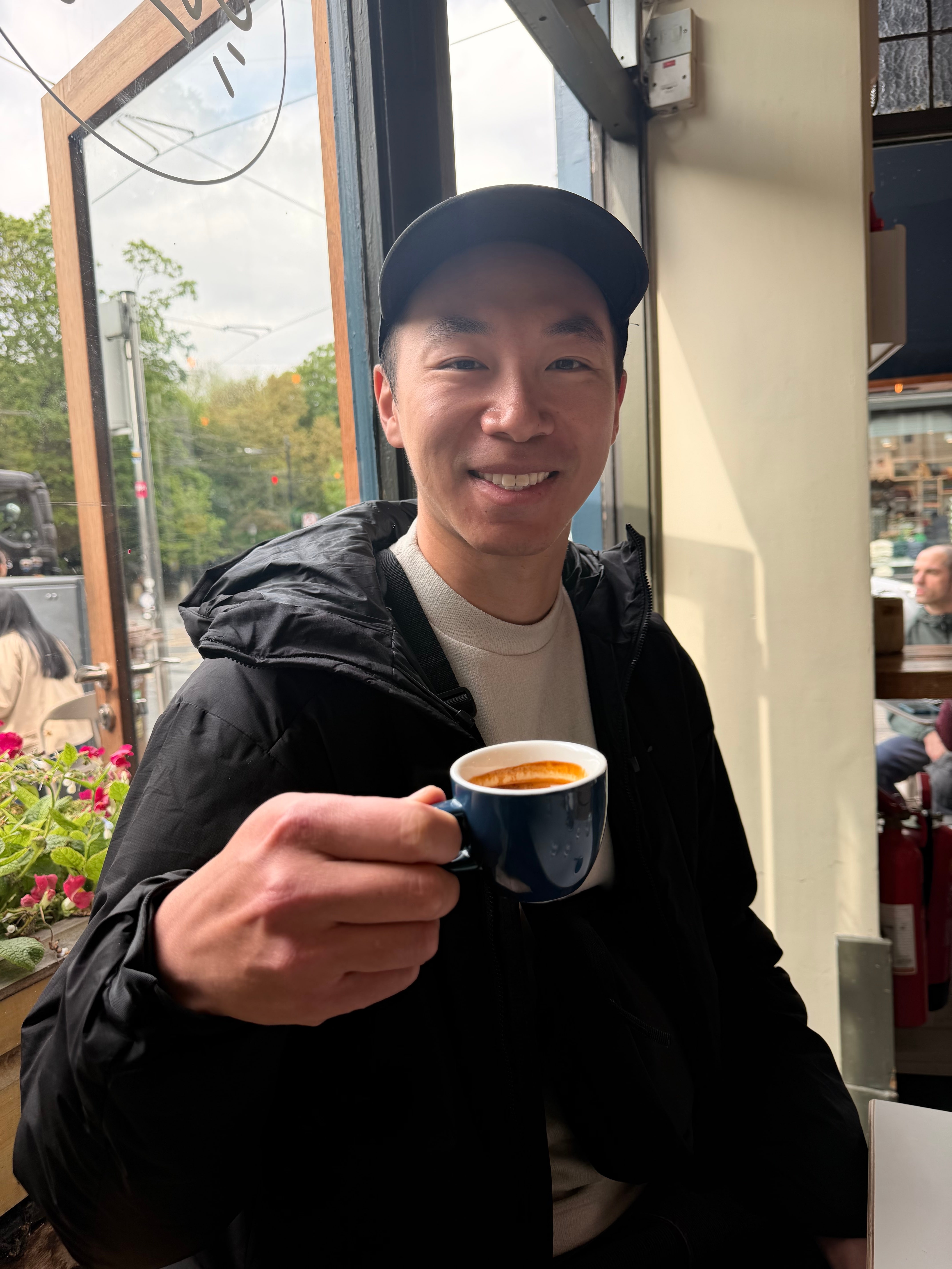 Jesse F. of Quadrant Cart holding a coffee